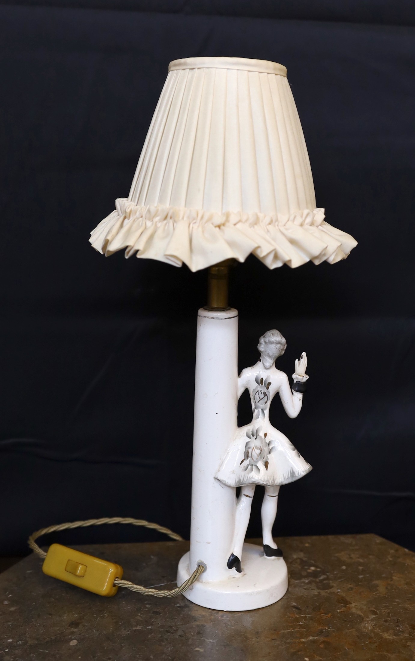 A 1950s German ceramic table lamp modelled with a gallant, height 30cm.